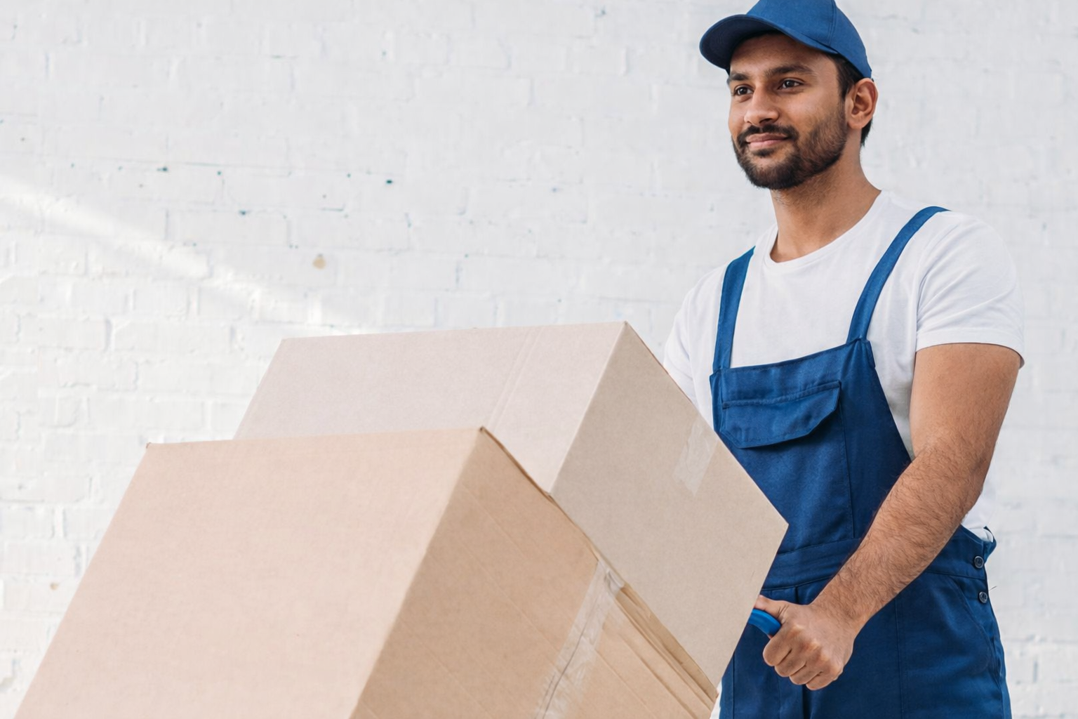 Sri Sapthagiri Best Packers and Movers South India professional handling cardboard boxes for household relocation services